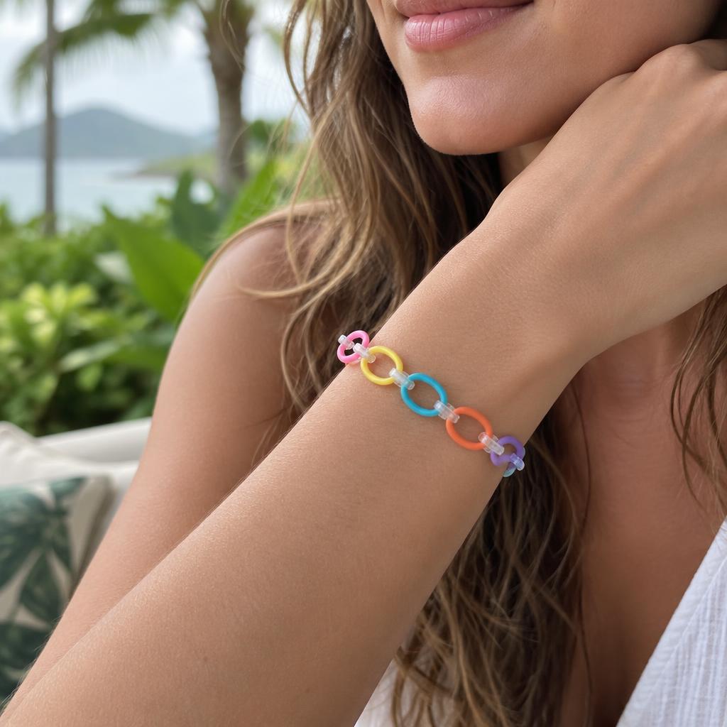 A grown-up wearing a Loopsy loop-chain bracelet